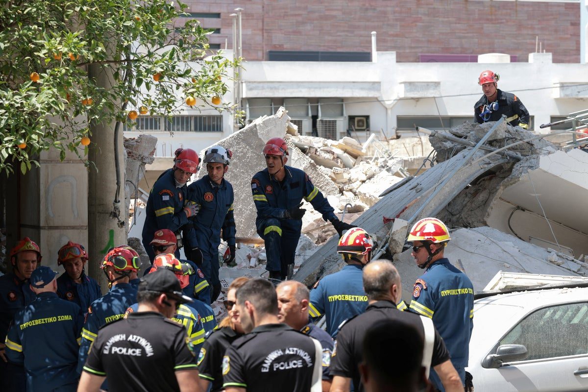 Search for trapped residents after apartment block collapses in Athens