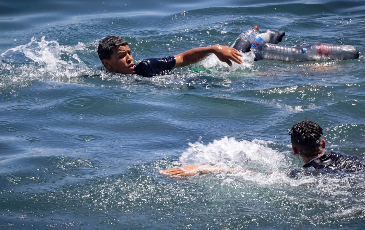 Thousands of migrants swim from Morocco to Spain's Ceuta territory