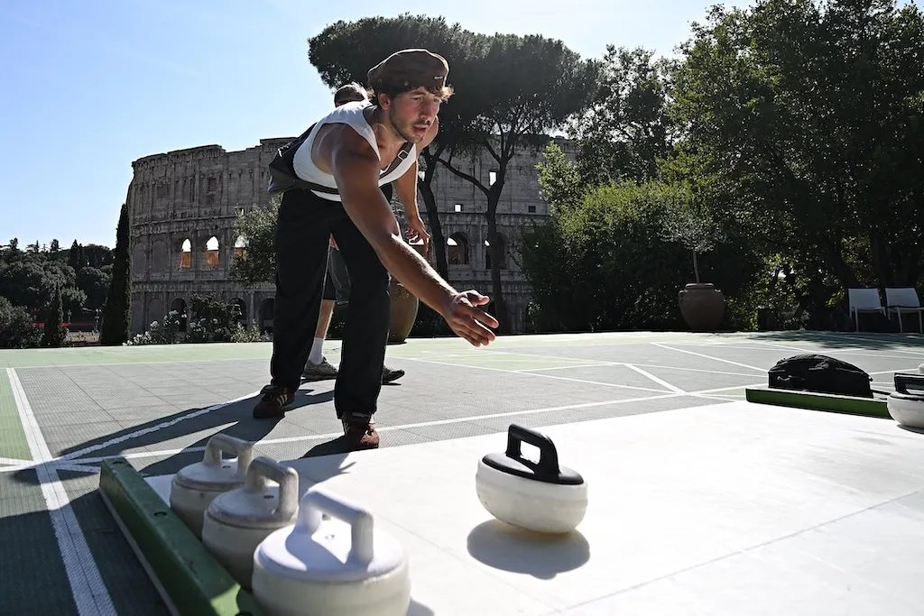 Curling attracts curious Romans under Colosseum's shadow