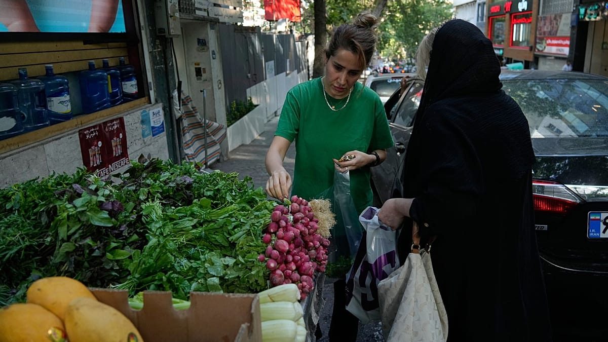 Iran's inflation spiral deepens as rial slides and tensions rise