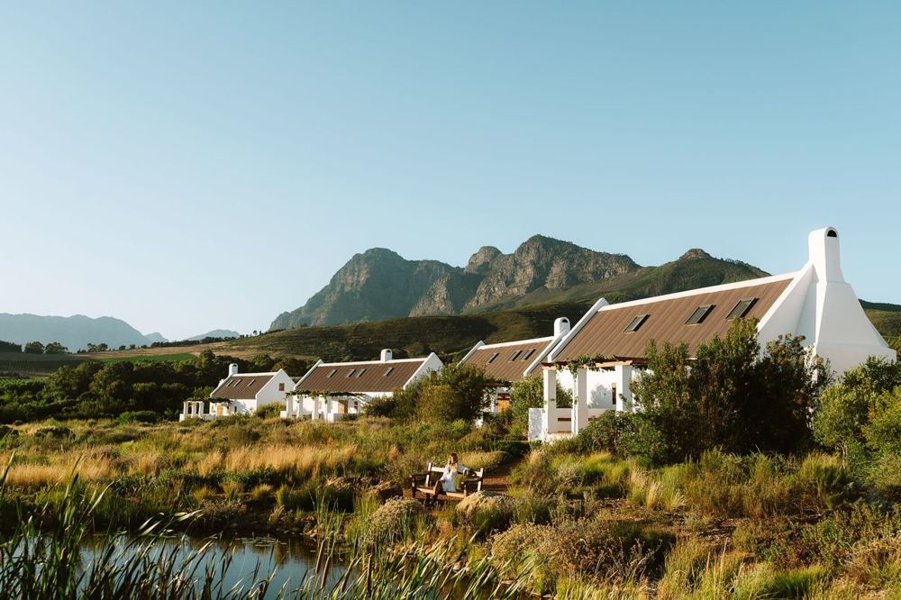 Working farm hotels are putting luxury guests to work in the fields