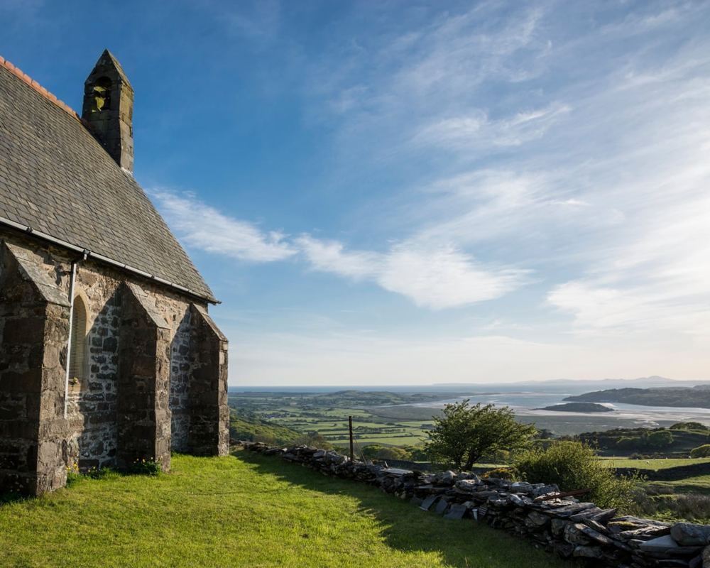 From churches and castles to wonderfully weird Portmeirion: exploring Wales’s north-west coast on foot and by train