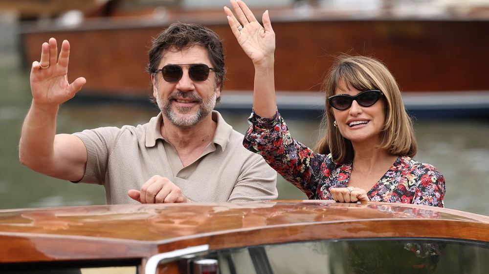 Penelope Cruz stuns in a floral dress as she heads off on a water taxi with Javier Bardem after breaking down in tears during 15-minute standing ovation at Venice Film Festival