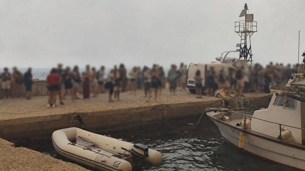 Hundreds escape Greek wildfire by sea as blazes continue across Europe
