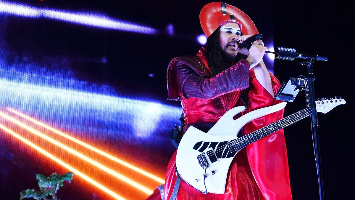 Heatwave? What heatwave? As London swelters, Empire Of The Sun's frontman takes to the stage in sequinned gown - and Samurai hat. Read our review...