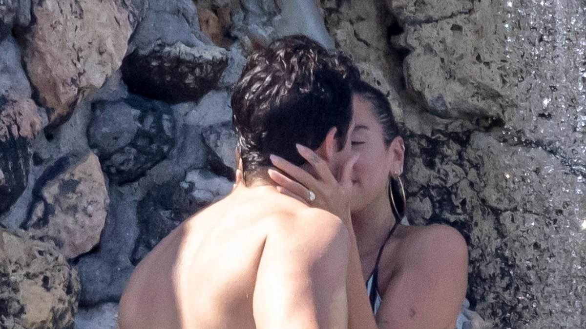 Bikini-clad Dua Lipa and shirtless Callum Turner send temperatures soaring as they share a passionate smooch in an outdoor shower on endless Italian honeymoon