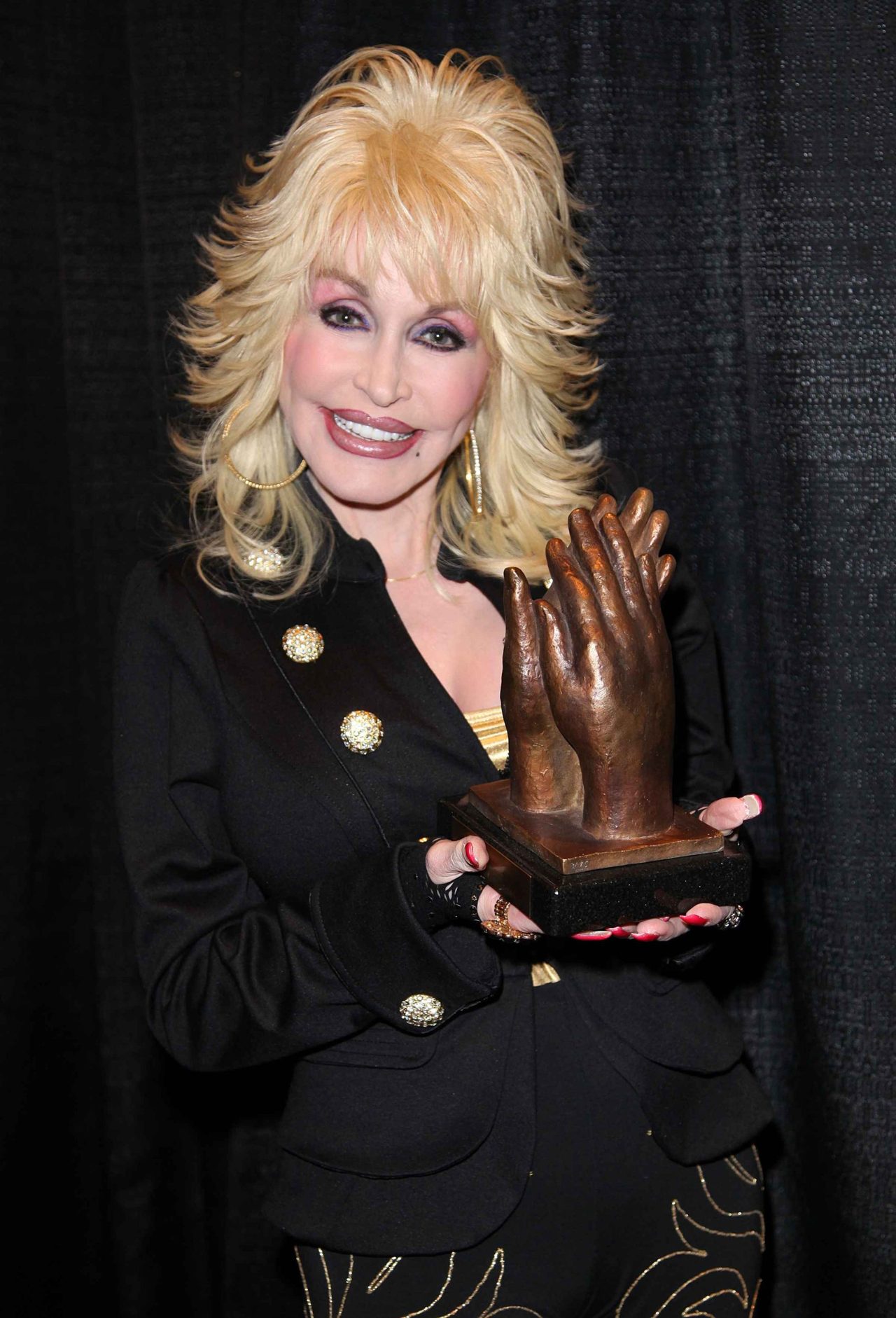 Dolly Parton, country music icon and humanitarian, dies at 80