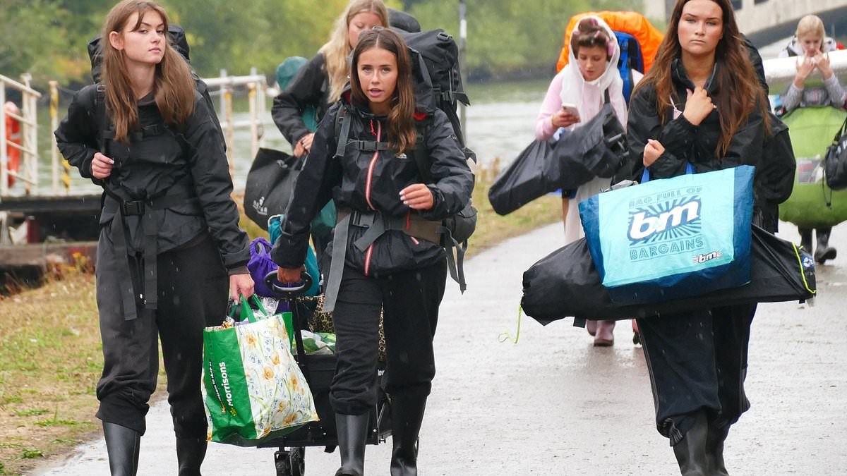 Thousands of revellers brave the rain as they set up camp at Reading festival ahead of Bank Holiday weekend