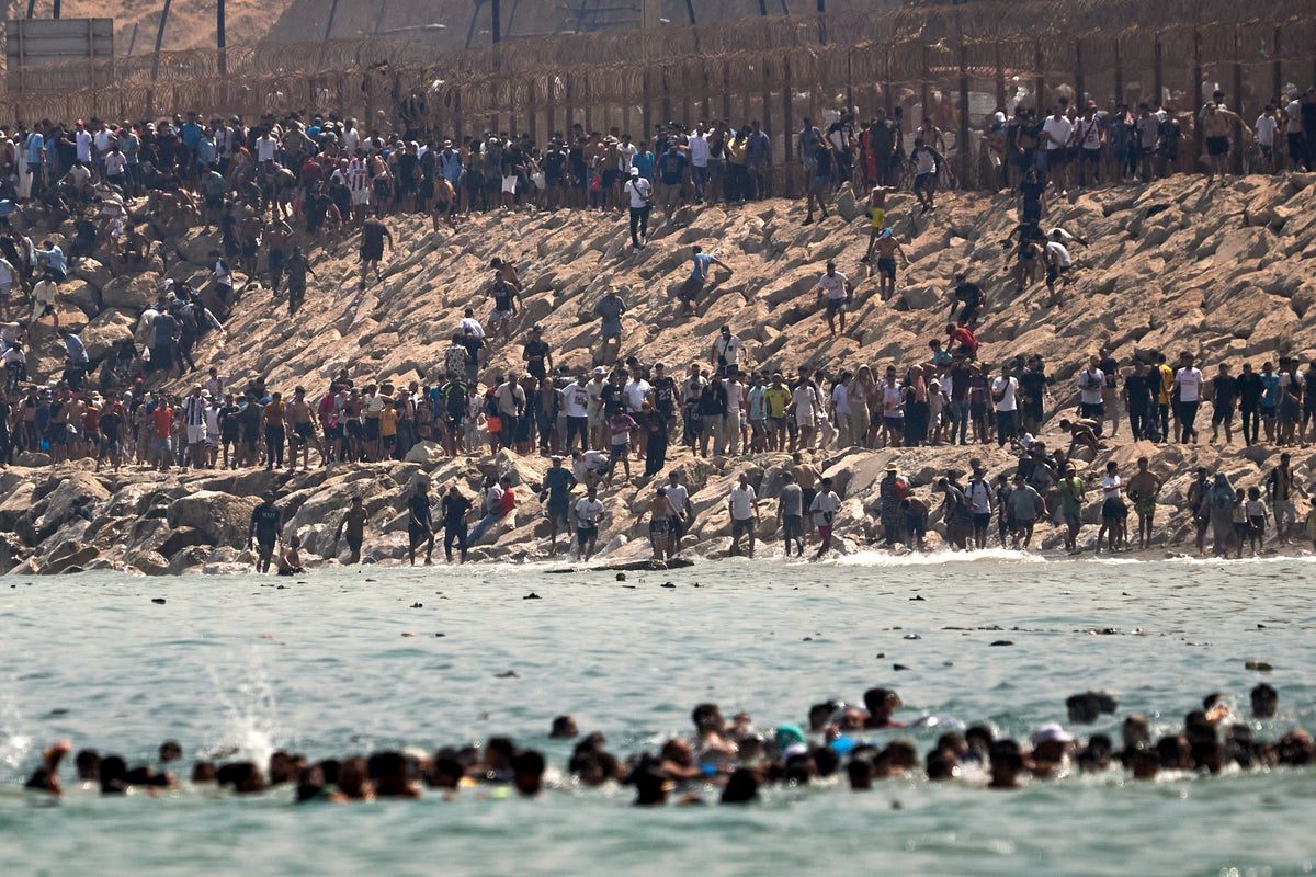 Thousands of migrants arrive in Ceuta as Spain sends army to ‘totally collapsed’ border