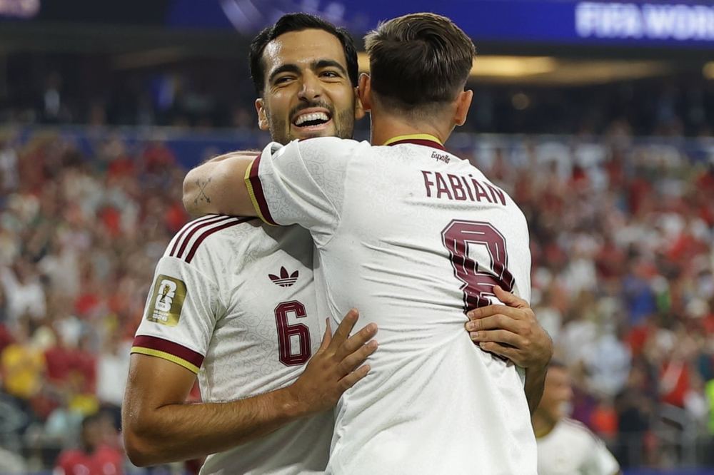 Spain reach World Cup quarter-finals after Merino's late winner