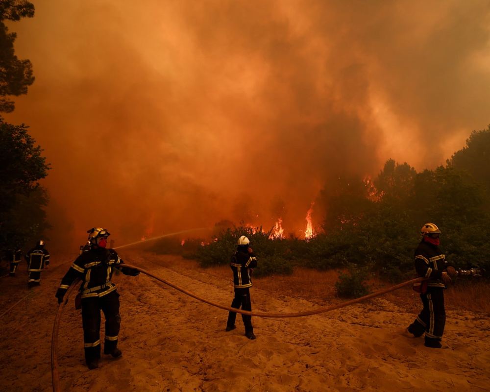 Wildfire evacuations and transboundary smoke raise health and adaptation costs in Europe