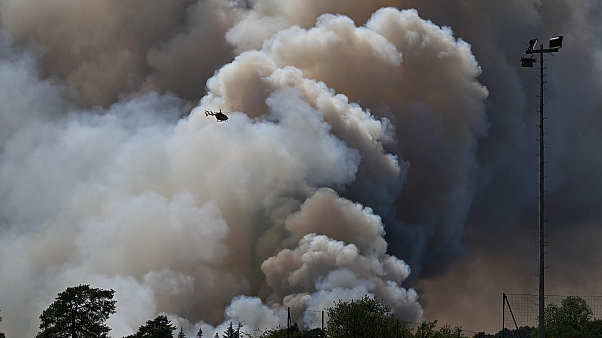 Major forest fires near Paris close A6 motorway as 1,900 hectares burn