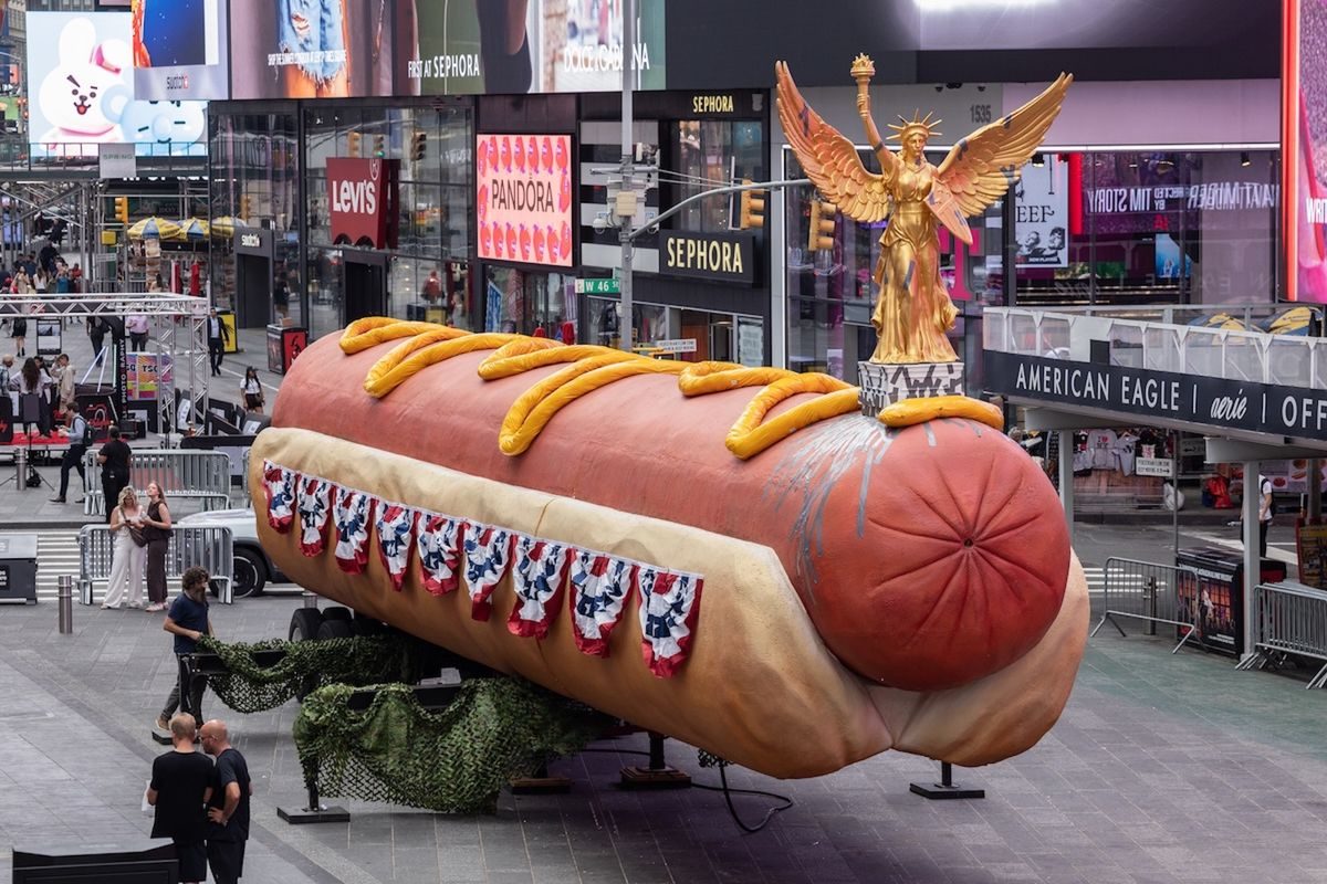 Artists’ monumental hot dog sculpture, now with patriotic toppings, returns to Times Square